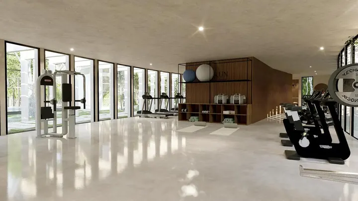 Gimnasio con aparatos en Okün Living