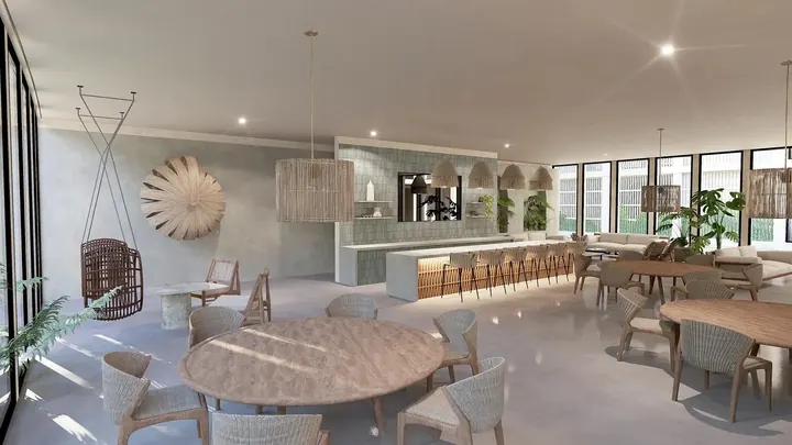 Salón social con mesas en Okün Living
