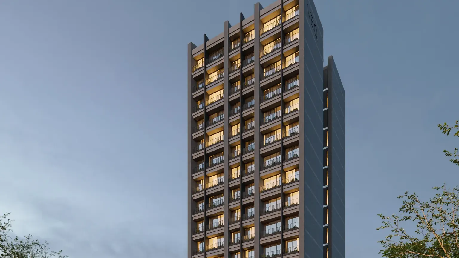 Fachada de VEQ Asunción al atardecer, torre de departamentos en Providencia
